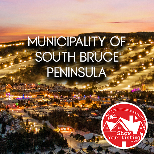 Stunning real estate photograph showcasing South Bruce Peninsula's sandy beaches, dramatic cliffs, and vibrant community life along Lake Huron, ideal for property listings and walkthrough videos.