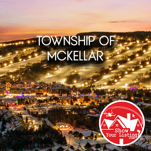 Stunning aerial view of McKellar Township showcasing lakes, snowmobile trails, and recreational activities, captured through expert Real Estate Photography and drone video for immersive virtual tours.