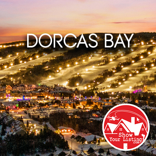 Stunning aerial view of Dorcas Bay showcasing white sand, warm shallow water, and wetlands—perfect for real estate photography and drone videos highlighting this scenic nature area.