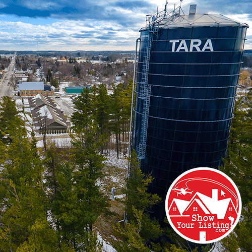 Drone photo showcasing the charming village of Tara, Bruce County, highlighting its vibrant community and ideal real estate opportunities for homes and properties.